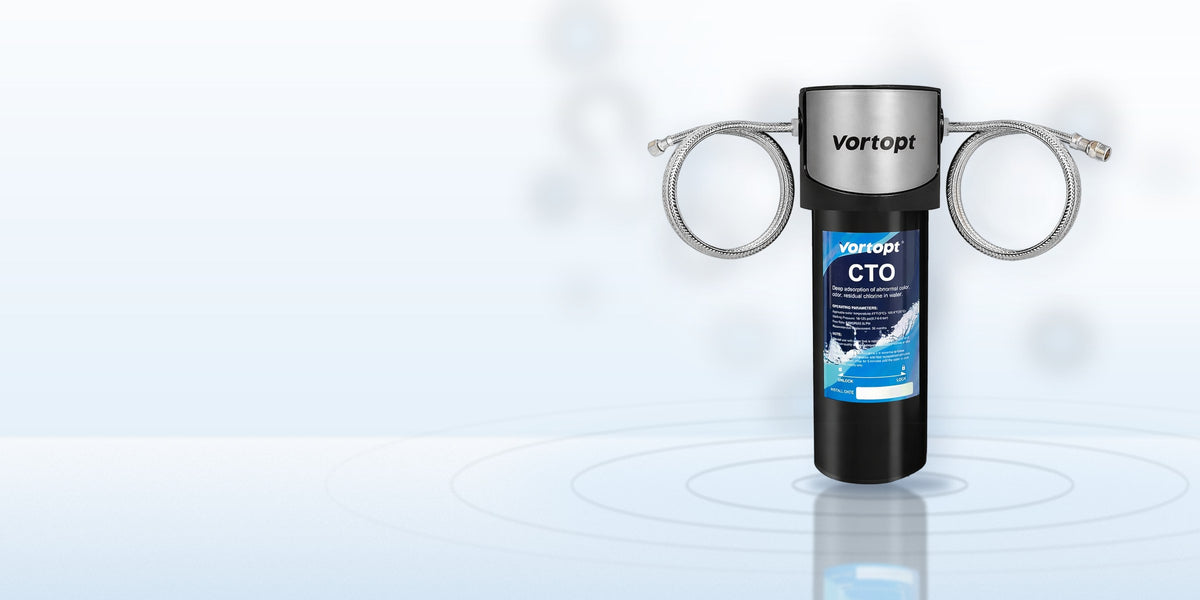 Vortopt Q7 under-sink water filter with braided hoses on a light blue water surface